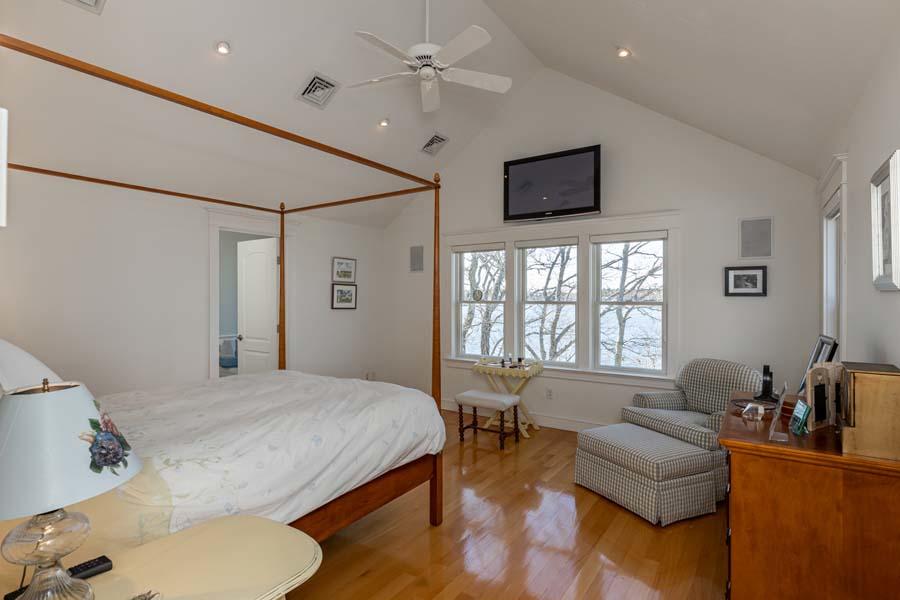 99 Monomoscoy Road West Mashpee, MA 02649 - Photo 23 of 43 a bedroom with a bed couch and a window