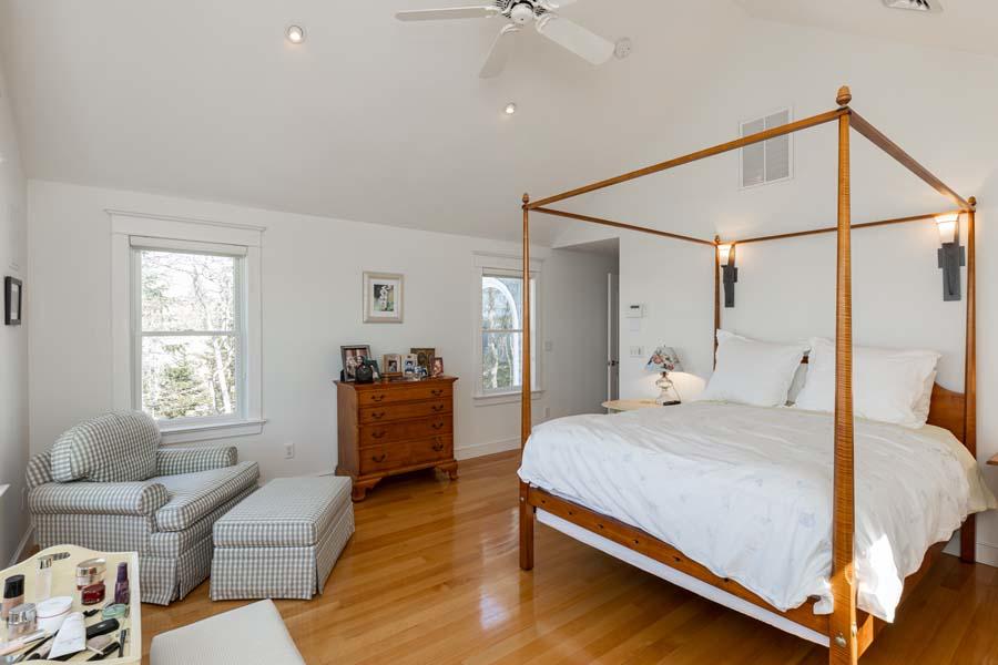 99 Monomoscoy Road West Mashpee, MA 02649 - Photo 24 of 43 a bedroom with a bed and a couch