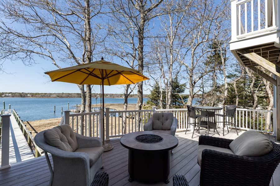 99 Monomoscoy Road West Mashpee, MA 02649 - Photo 32 of 43 a view of a roof deck with furniture