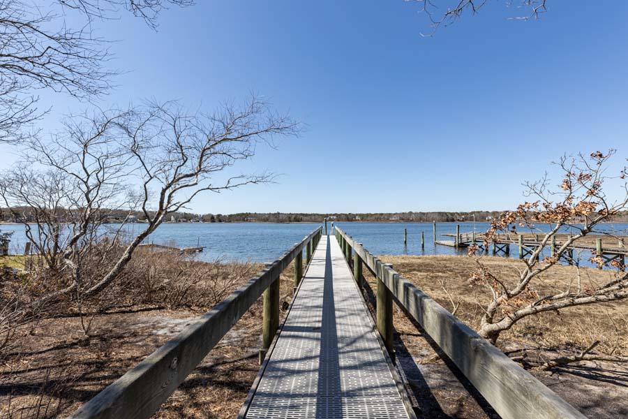 99 Monomoscoy Road West Mashpee, MA 02649 - Photo 34 of 43 a view of balcony with wooden floor and seating space