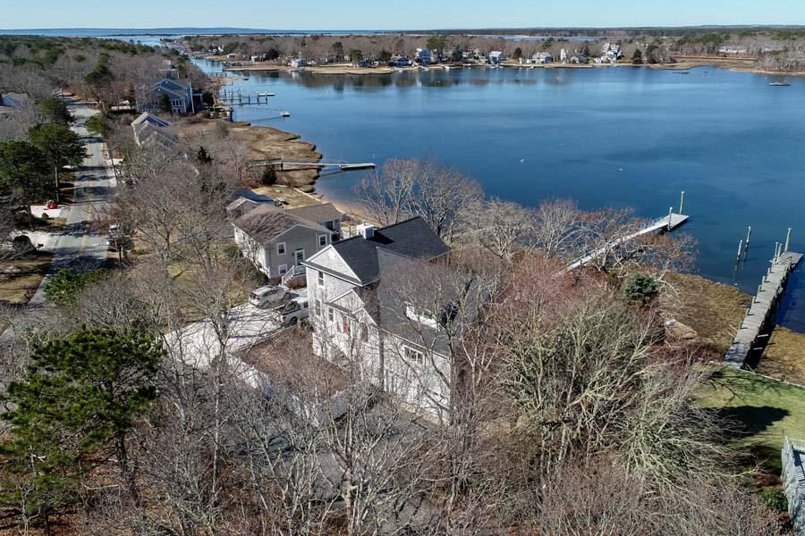 99 Monomoscoy Road West Mashpee, MA 02649 - Photo 37 of 43 an aerial view of house with outdoor space and lake view