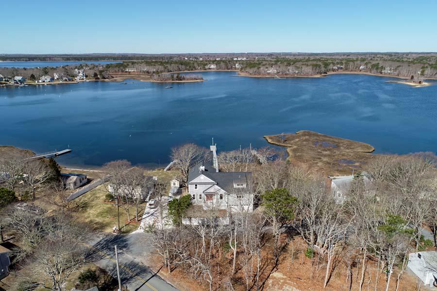 99 Monomoscoy Road West Mashpee, MA 02649 - Photo 38 of 43 an aerial view of a houses with a lake view