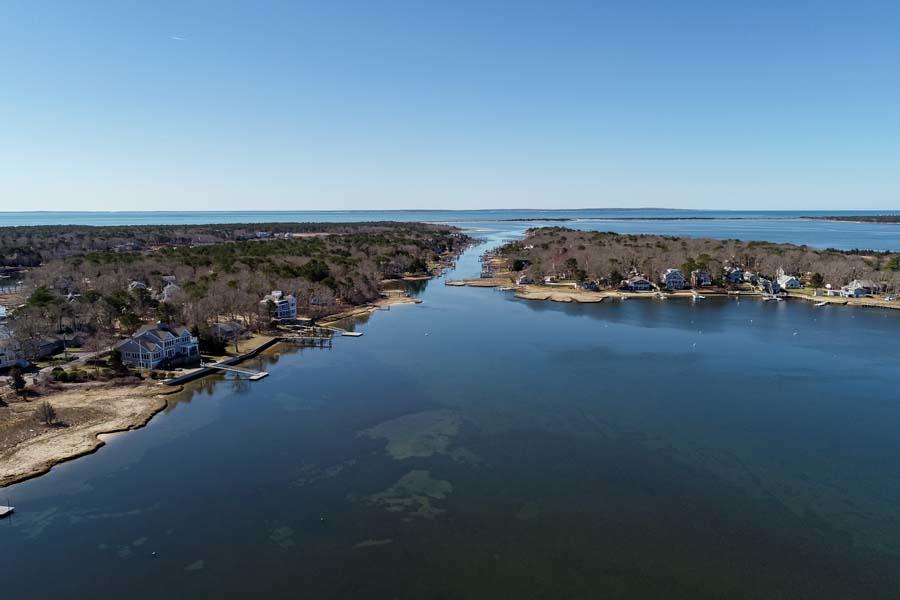 99 Monomoscoy Road West Mashpee, MA 02649 - Photo 40 of 43 an aerial view of a ocean beach