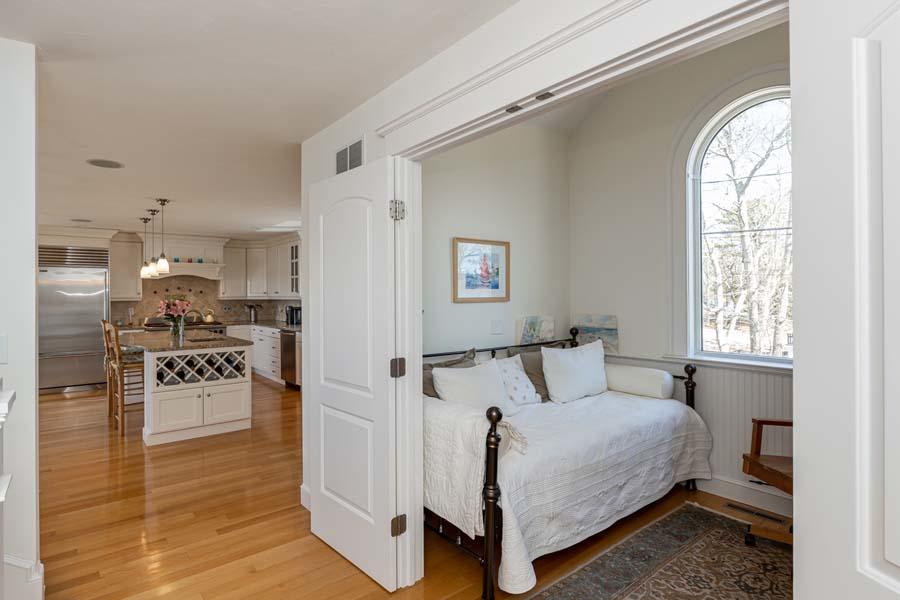 99 Monomoscoy Road West Mashpee, MA 02649 - Photo 10 of 43 a bedroom with a bed and wooden floor