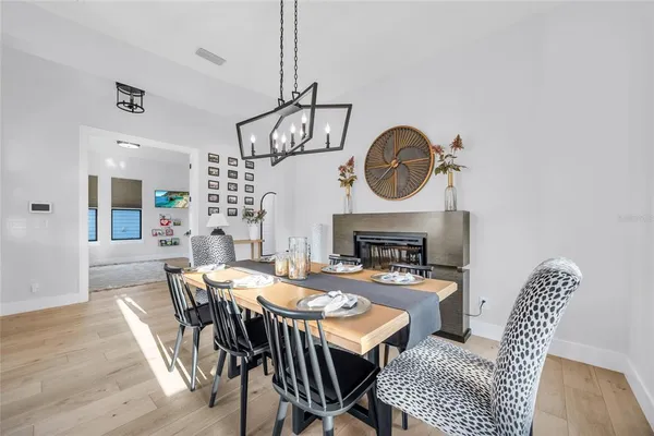 a living room with stainless steel appliances kitchen island granite countertop wooden floors and view living room