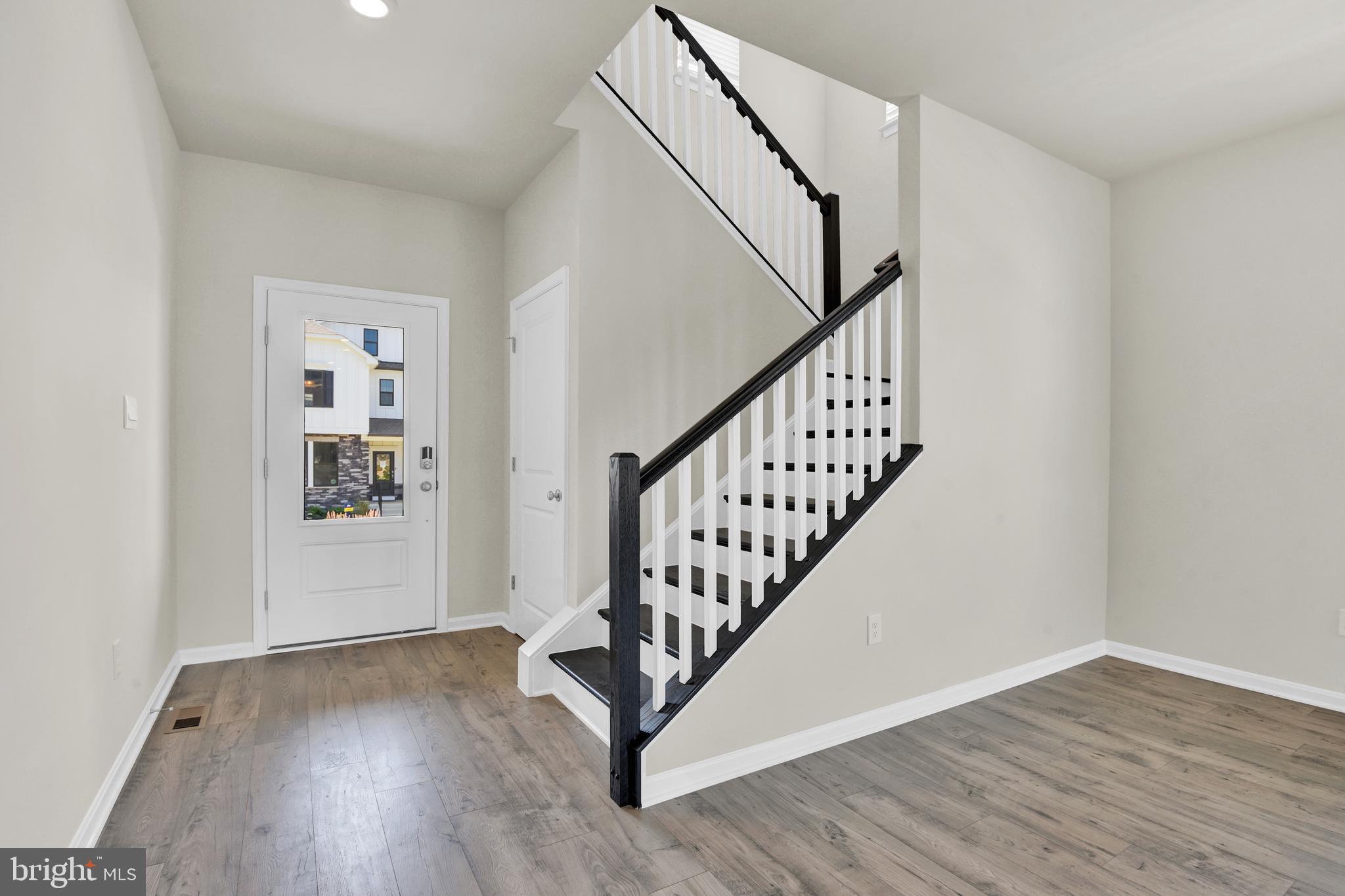 462 Herringbone Way Frederick, MD 21701 - Photo 3 of 29 a view of an entryway with wooden floor