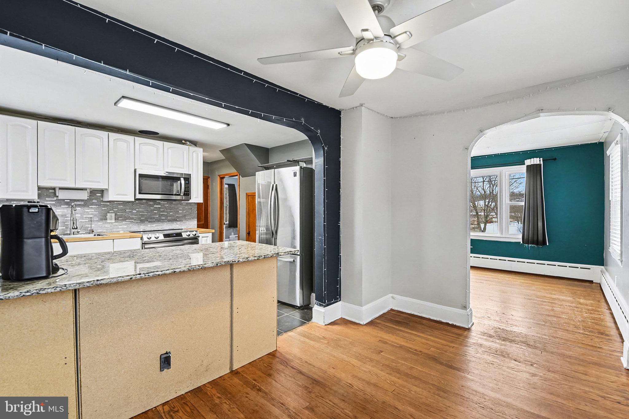 4818 Ridge Road Rosedale, MD 21237 - Photo 12 of 30 a kitchen with stainless steel appliances granite countertop a refrigerator a stove and a sink