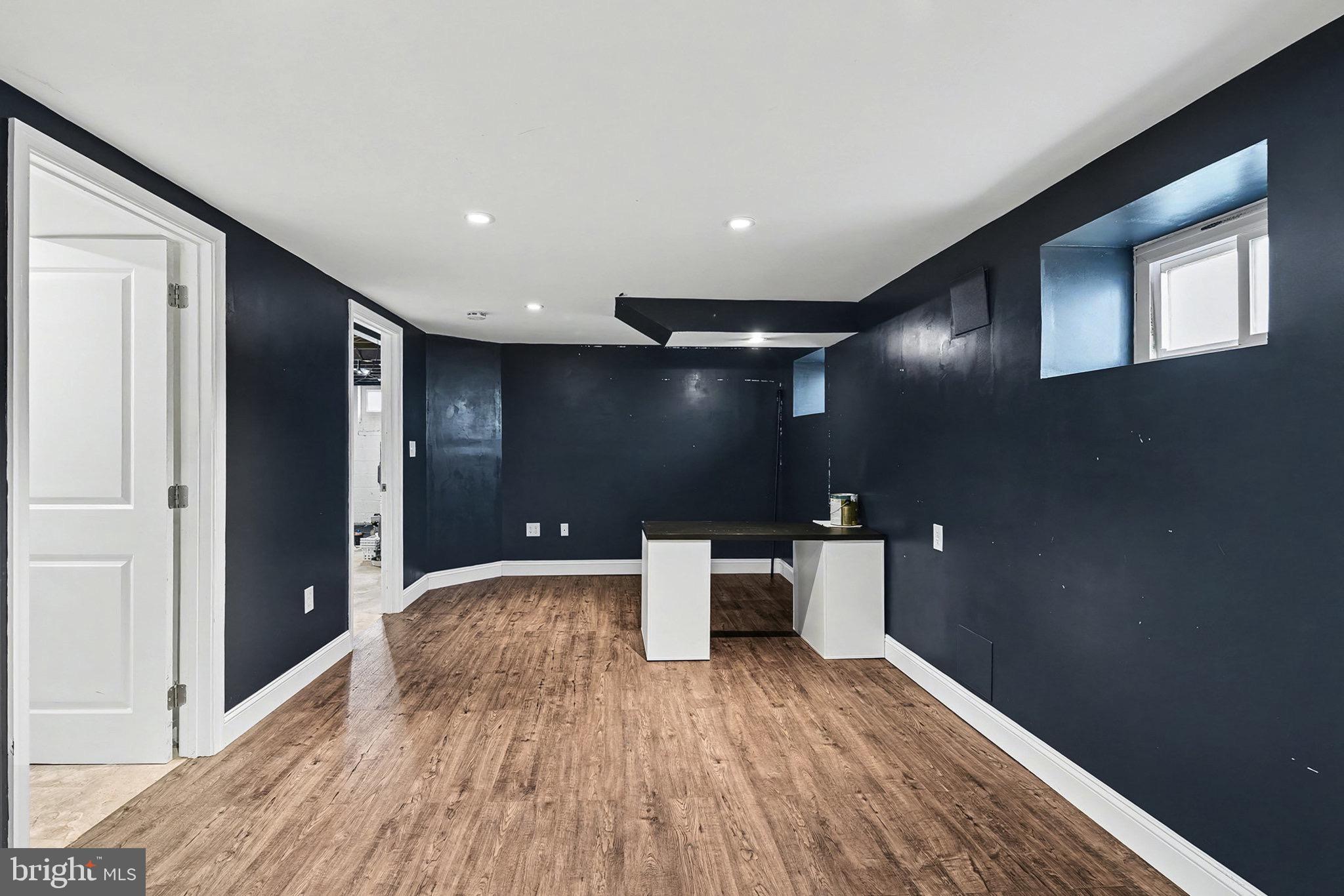 4818 Ridge Road Rosedale, MD 21237 - Photo 15 of 30 a view of a hallway with wooden floor