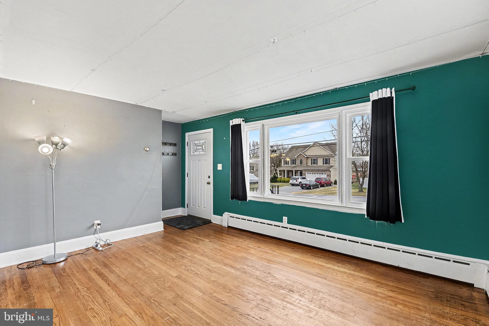 4818 Ridge Road Rosedale, MD 21237 - Photo 6 of 30 a view of a room with window wooden floor and front door