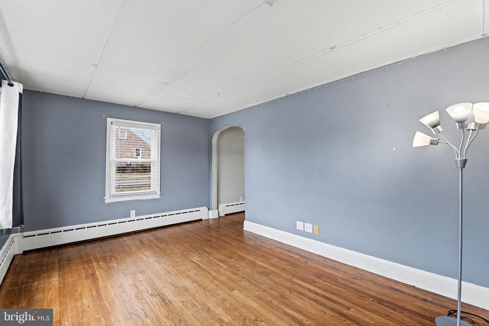 4818 Ridge Road Rosedale, MD 21237 - Photo 7 of 30 a view of a big room with wooden floor and windows