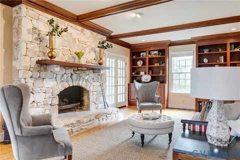 a large kitchen with kitchen island a sink a counter top space and stainless steel appliances