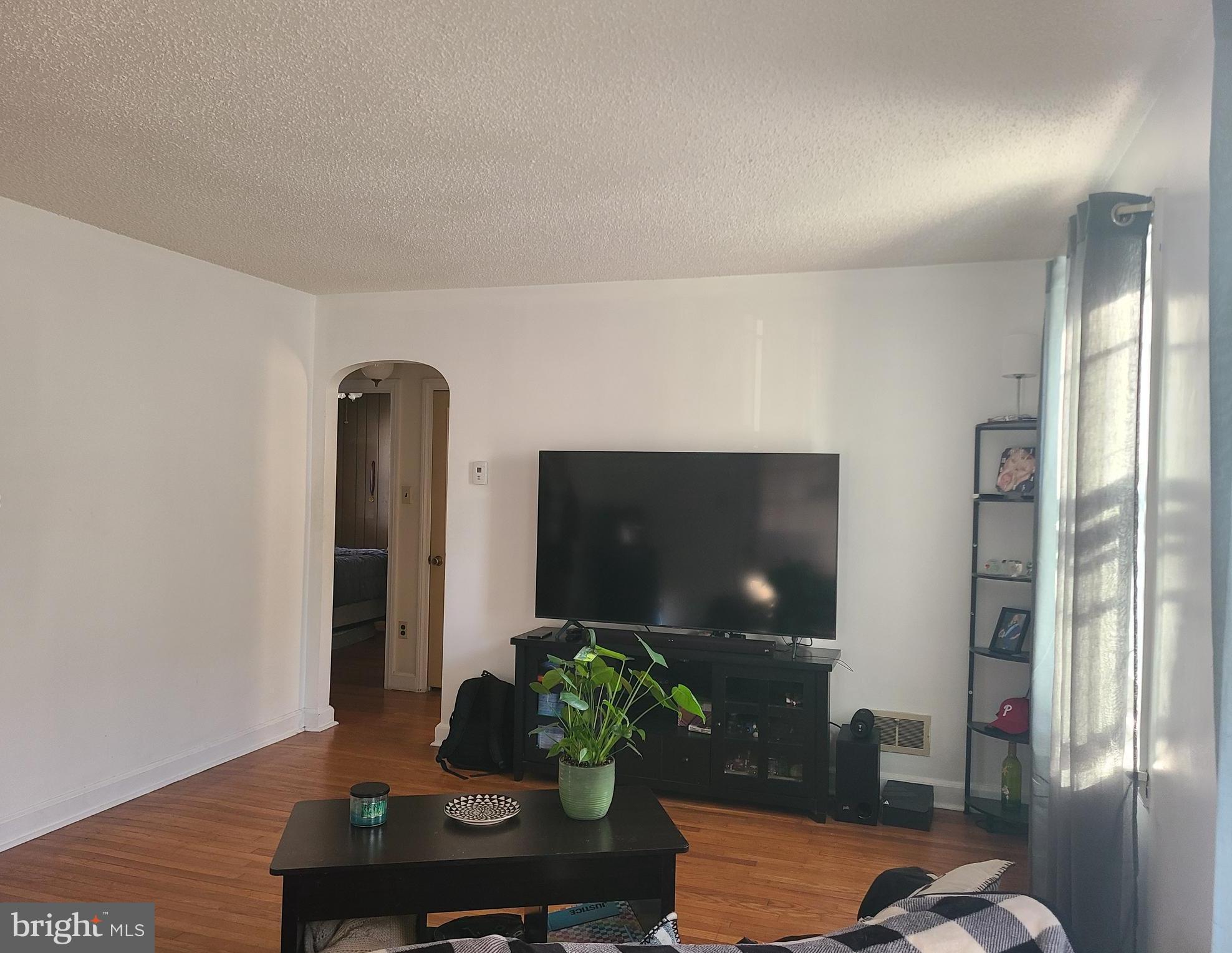 4912 Shepherd Street Brookhaven, PA 19015 - Photo 3 of 12 a living room with furniture and a flat screen tv