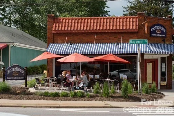 a swimming pool with outdoor seating and yard