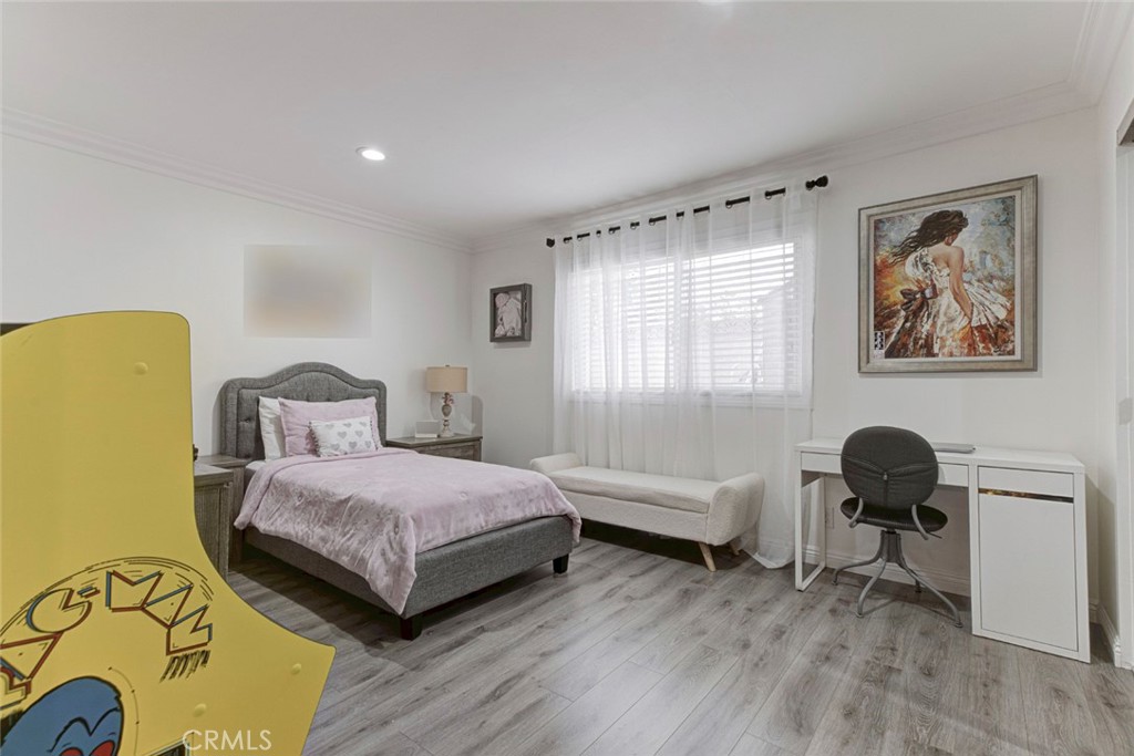 9350 Rhea Avenue Northridge, CA 91324 - Photo 9 of 20 a bedroom with a bed and a chair