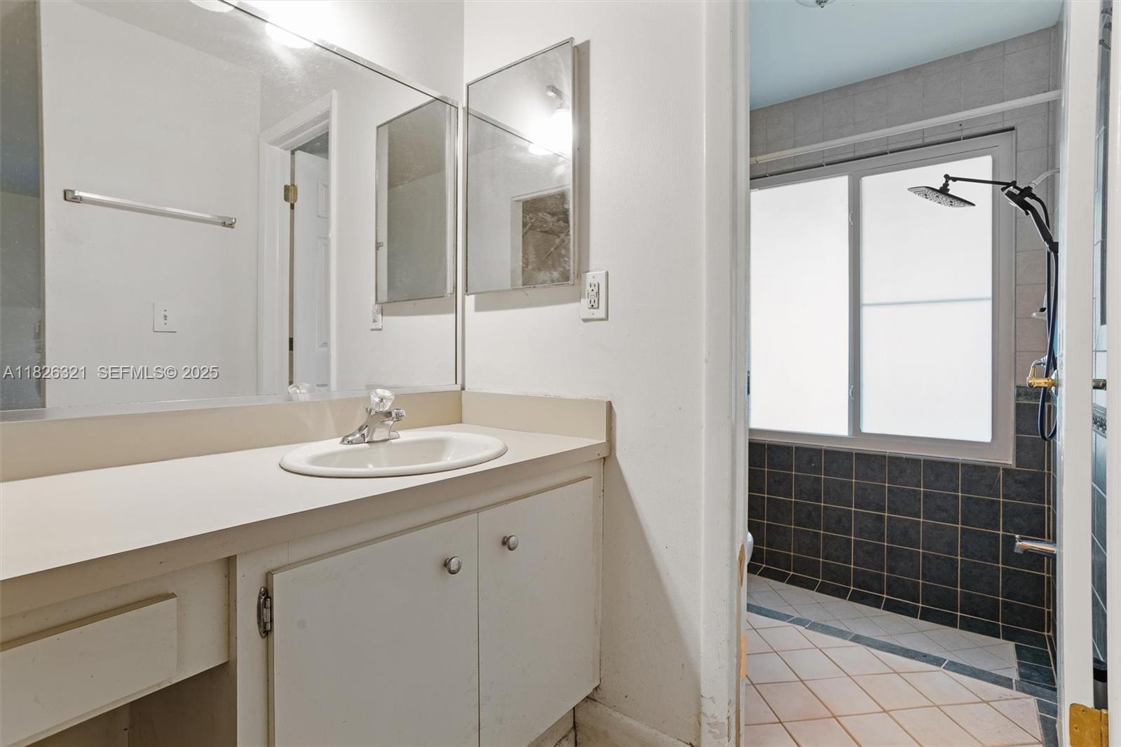 50 Forest Circle Cooper City, FL 33026 - Photo 12 of 22 a bathroom with a sink a vanity and a mirror