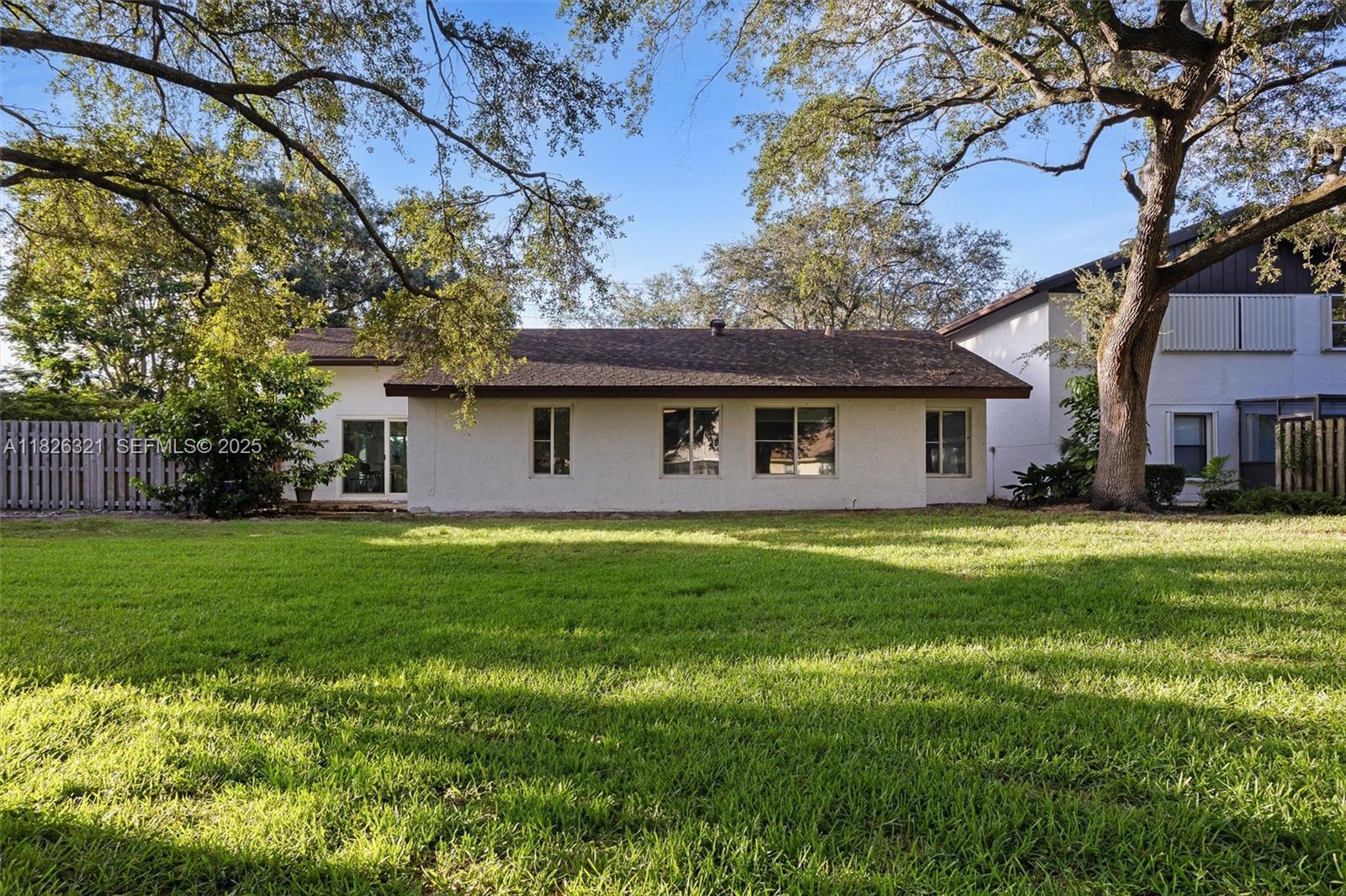 50 Forest Circle Cooper City, FL 33026 - Photo 4 of 22 a view of a house with a backyard