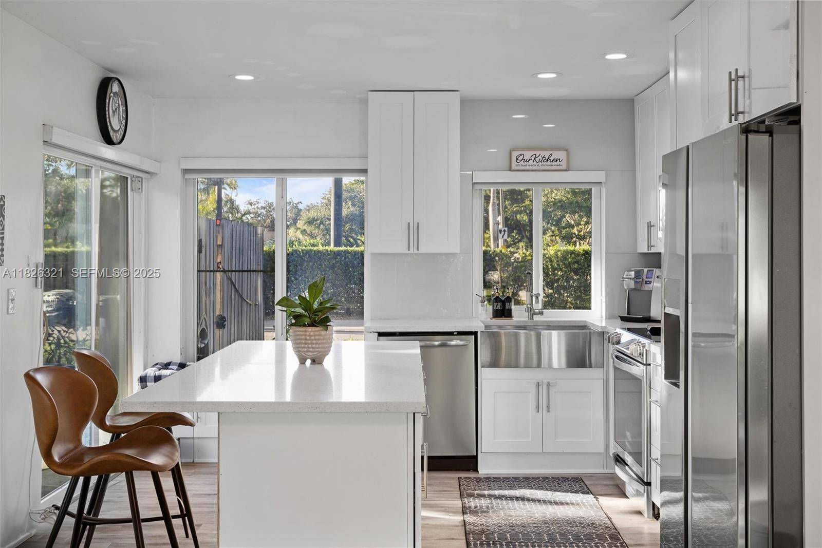 50 Forest Circle Cooper City, FL 33026 - Photo 7 of 22 a kitchen with stainless steel appliances granite countertop a refrigerator and a stove top oven