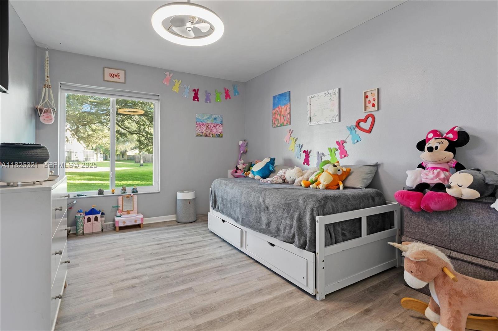 50 Forest Circle Cooper City, FL 33026 - Photo 8 of 22 a bedroom with a bed and a window