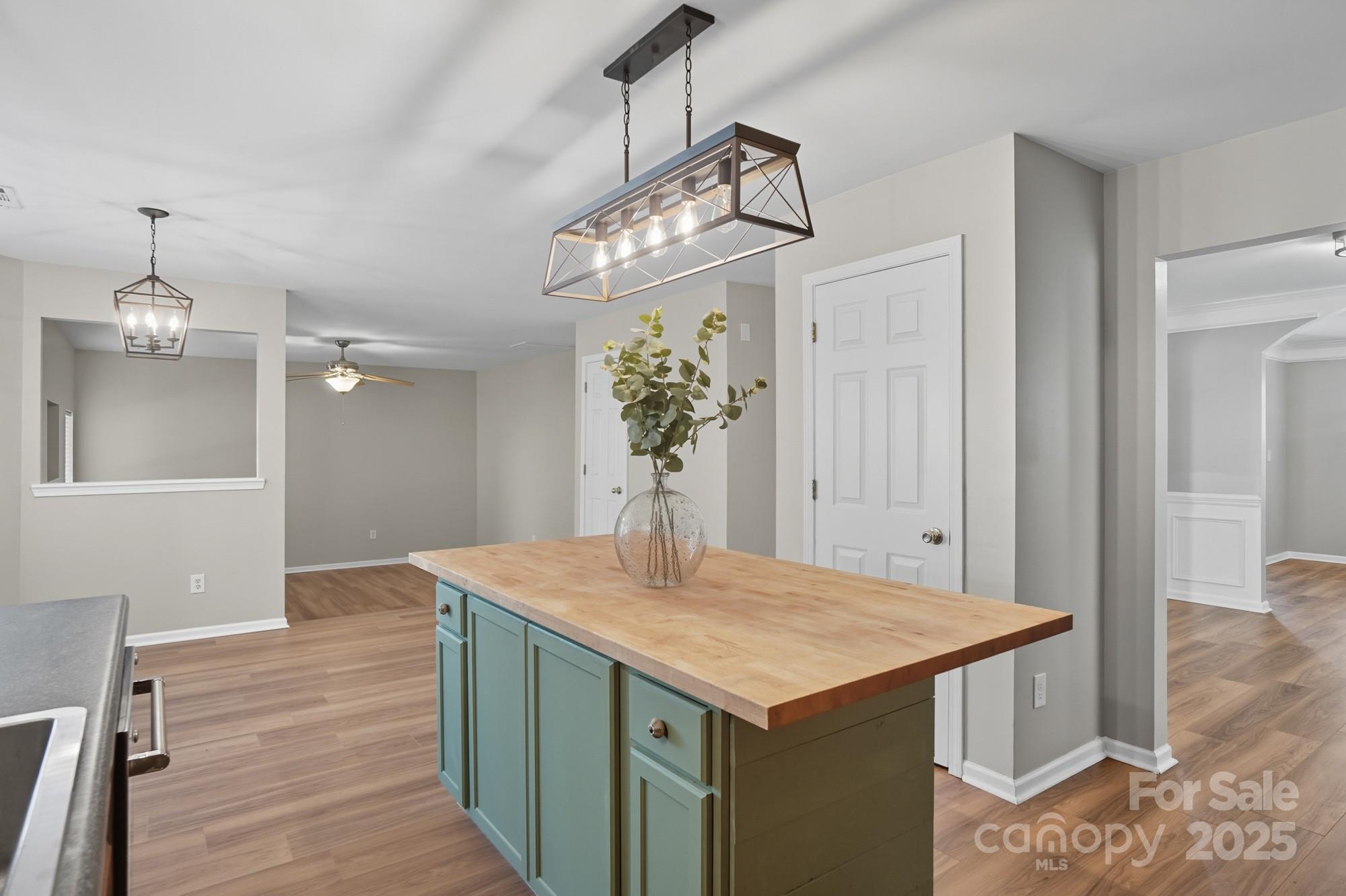 3060 Rocket Road Rock Hill, SC 29732 - Photo 11 of 31 a kitchen that has a kitchen island wooden cabinets and entryway