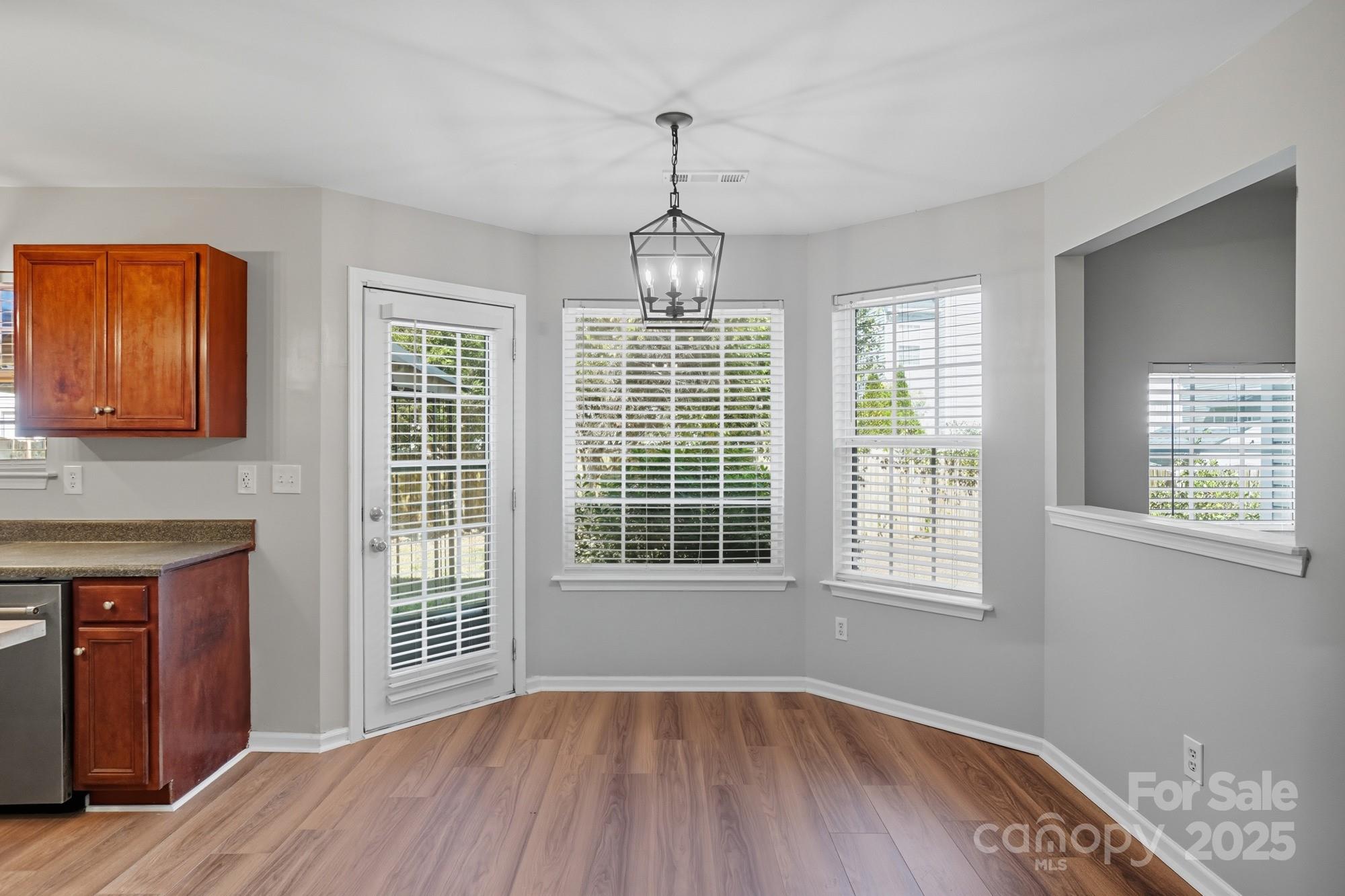 3060 Rocket Road Rock Hill, SC 29732 - Photo 13 of 31 a view of an empty room with wooden floor and a window