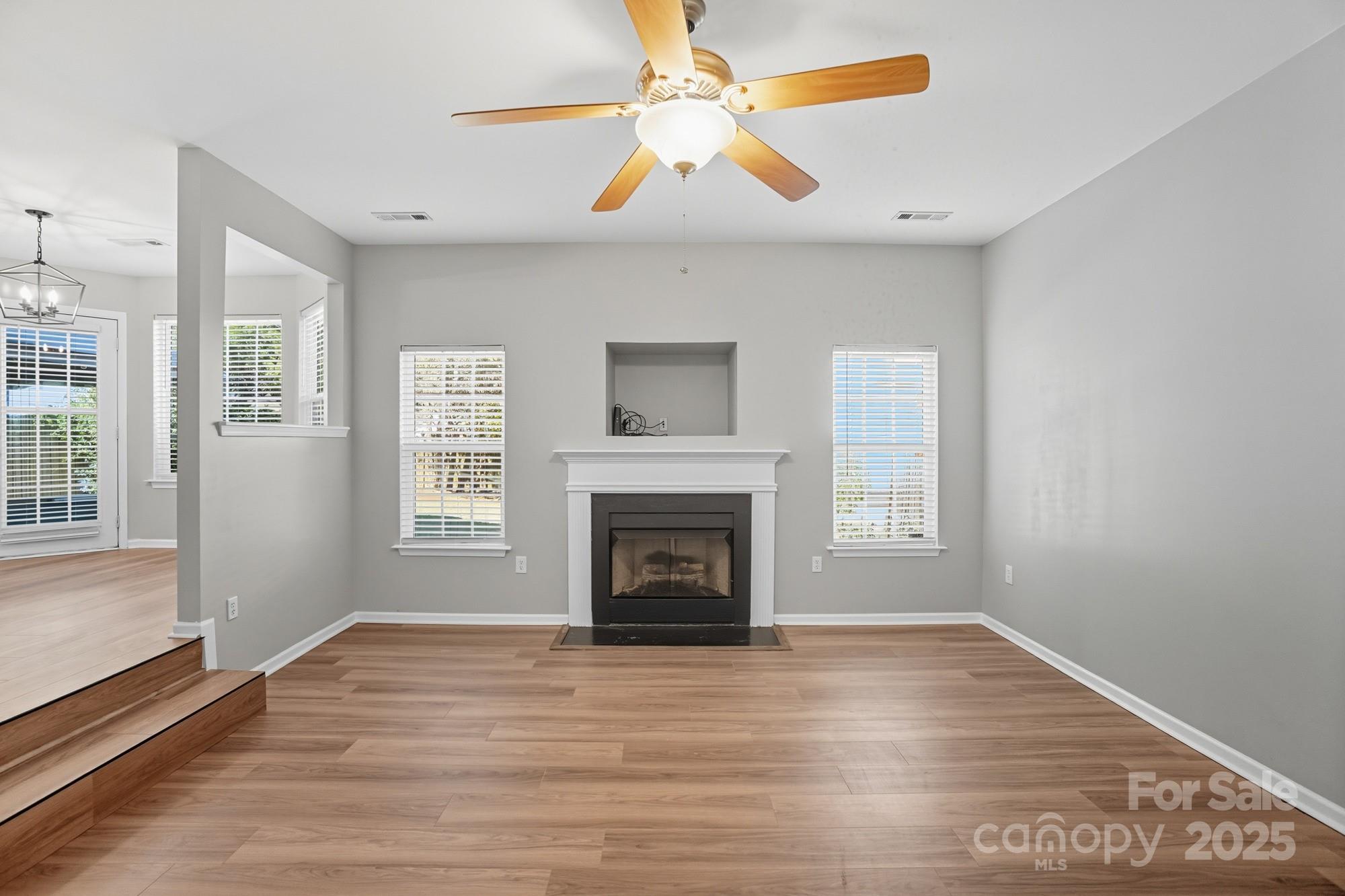 3060 Rocket Road Rock Hill, SC 29732 - Photo 15 of 31 wooden floor fireplace and windows in an empty room