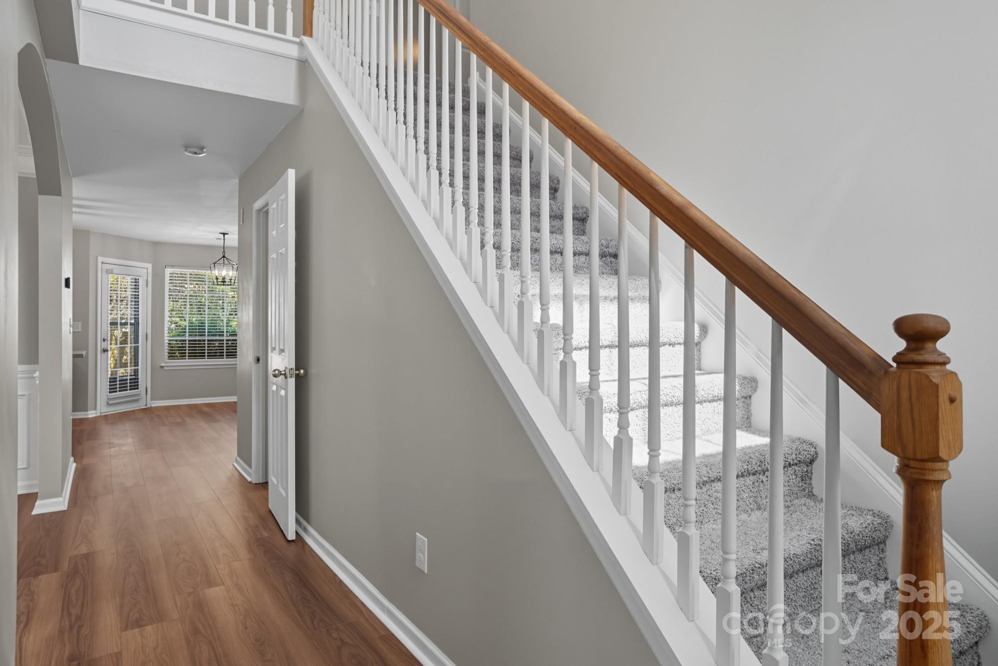 3060 Rocket Road Rock Hill, SC 29732 - Photo 4 of 31 a view of staircase with wooden floor and white walls