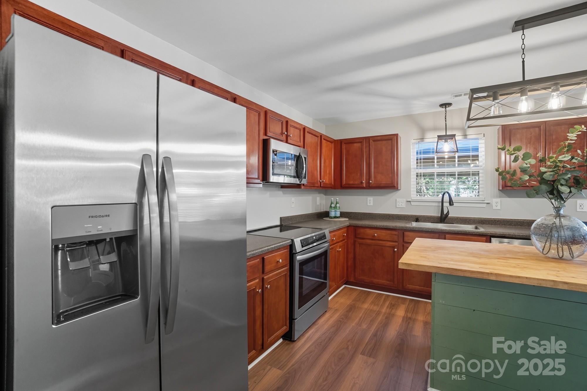 3060 Rocket Road Rock Hill, SC 29732 - Photo 9 of 31 a kitchen with stainless steel appliances granite countertop a sink a stove and a refrigerator