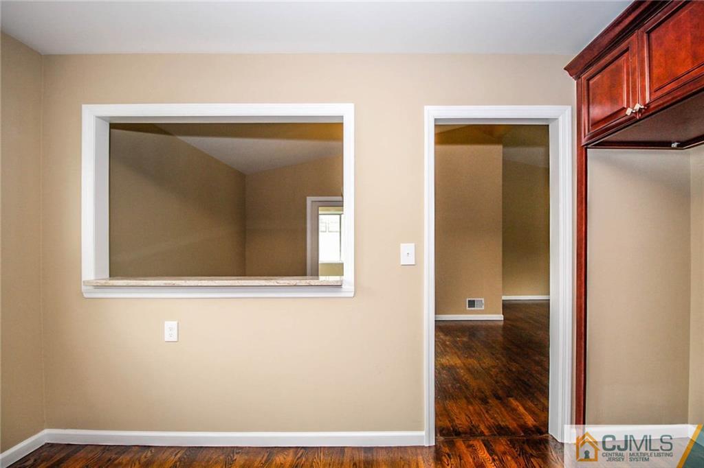44 Harmon Road Edison, NJ 08837 - Photo 14 of 25 a view of a bedroom from a hallway