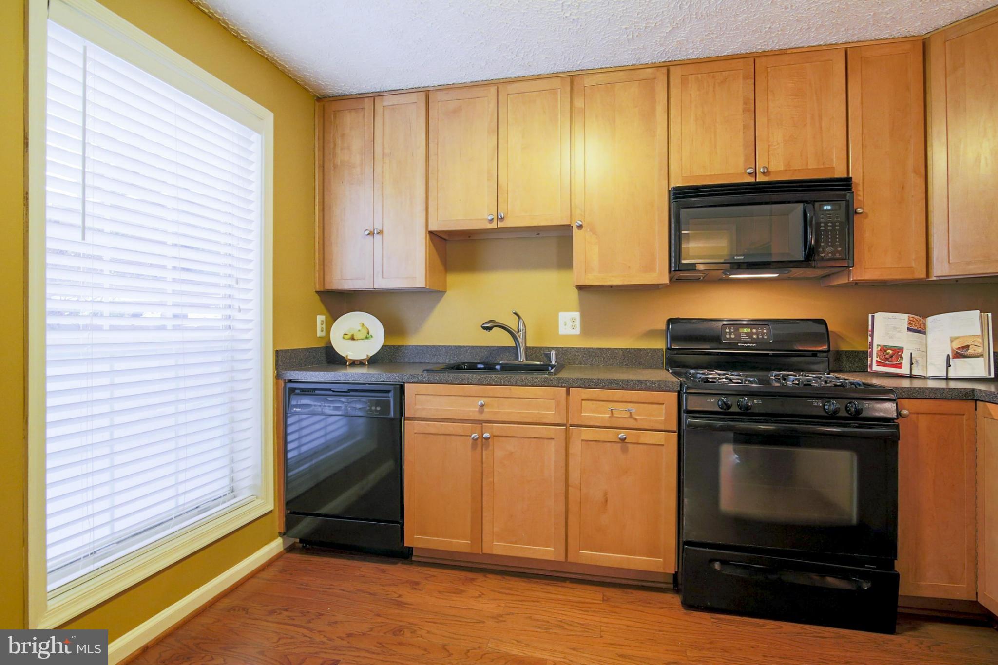 10153 Oakton Terrace Road, Unit 10153 Oakton, VA 22124 - Photo 7 of 23 Kitchen with large window adding natural light.