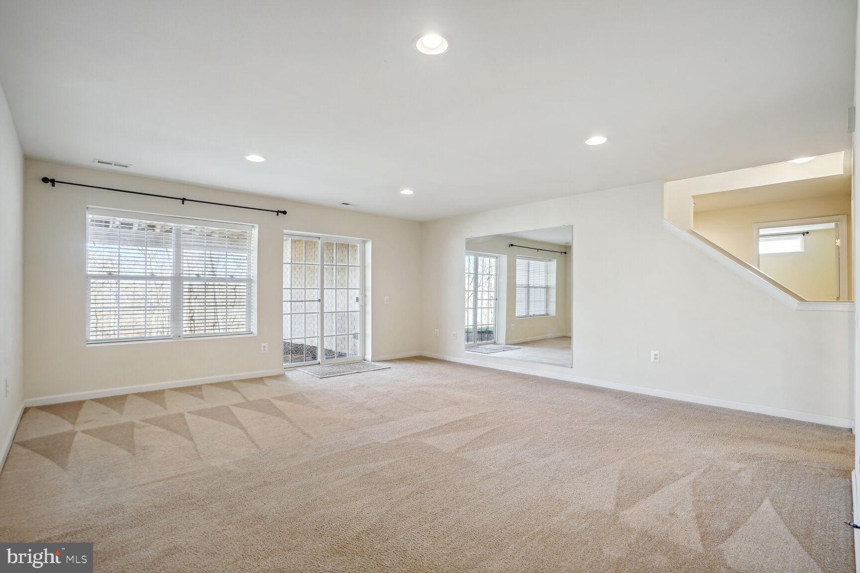 12036 Rutherglen Place Bristow, VA 20136 - Photo 23 of 39 Walk out to patio from lower level recreation room