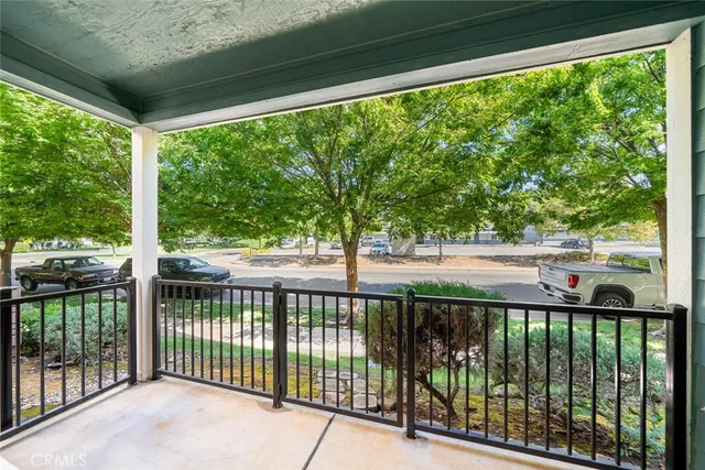 a view of a street view from a balcony