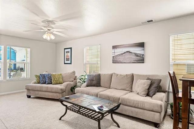 a living room with furniture a bed and a couch