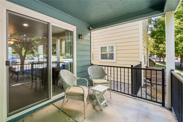 a view of a two chairs in the balcony