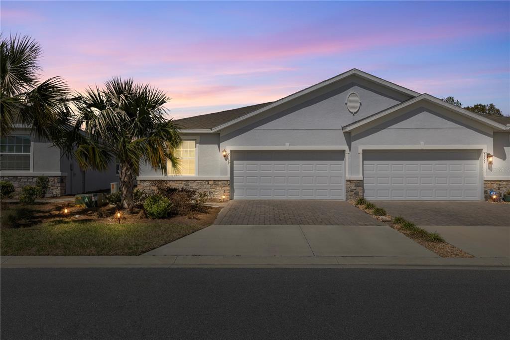 5369 Northwest 48th Lane Ocala, FL 34482 - Photo 1 of 47 a front view of a house with garden