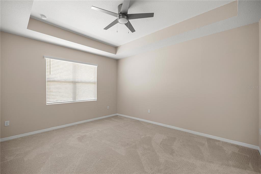 5369 Northwest 48th Lane Ocala, FL 34482 - Photo 15 of 47 an empty room with a window and a fan
