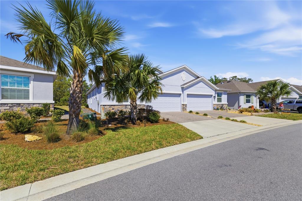 5369 Northwest 48th Lane Ocala, FL 34482 - Photo 2 of 47 a front view of house with yard and green space
