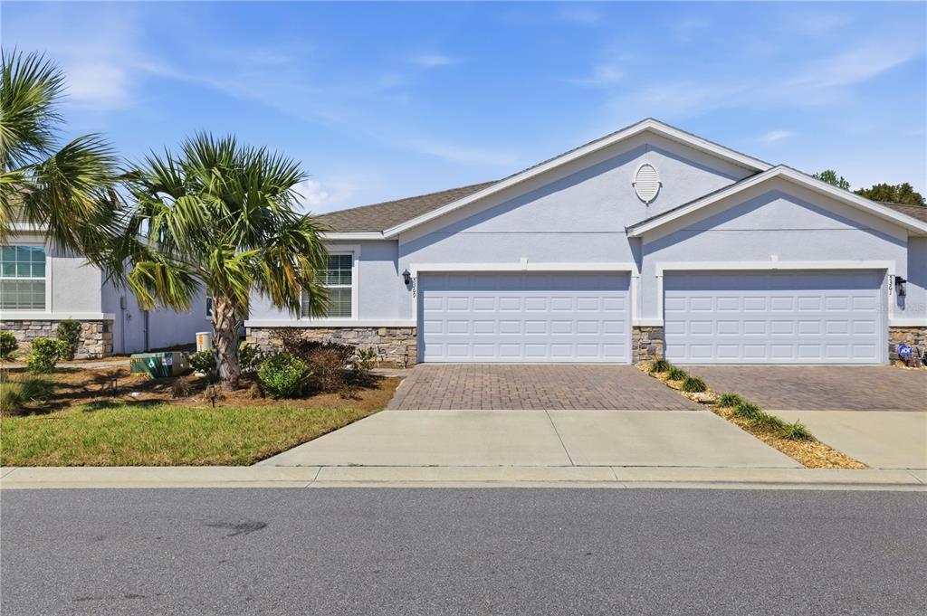 5369 Northwest 48th Lane Ocala, FL 34482 - Photo 3 of 47 a front view of a house with garden