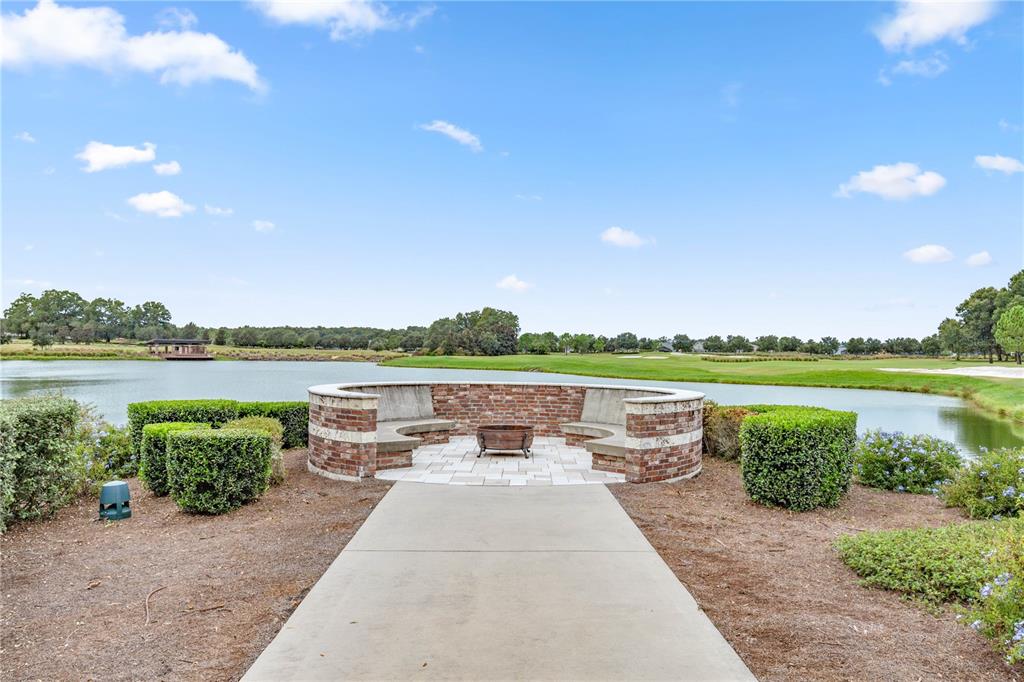 5369 Northwest 48th Lane Ocala, FL 34482 - Photo 47 of 47 a view of a lake with a garden and outdoor seating