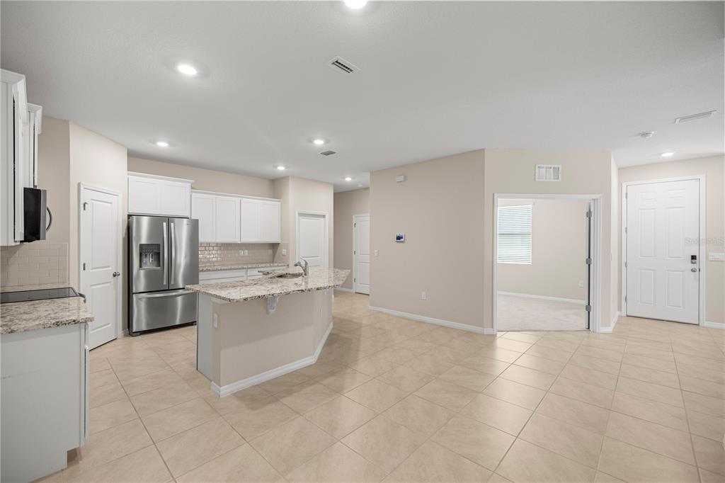 5369 Northwest 48th Lane Ocala, FL 34482 - Photo 8 of 47 a kitchen with stainless steel appliances a refrigerator and a stove top oven