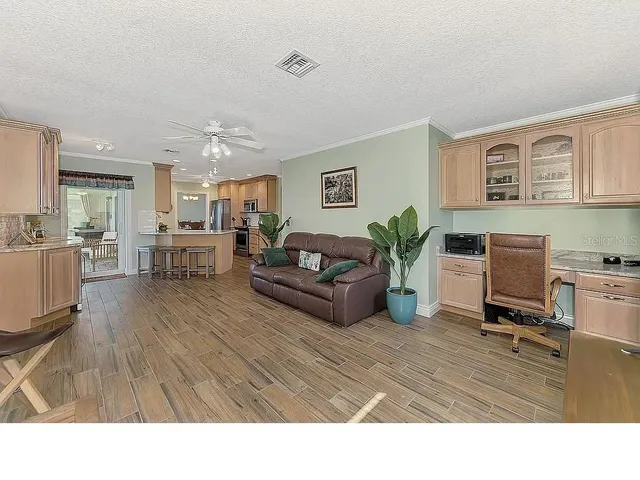 a bedroom with a bed and a flat tv screen