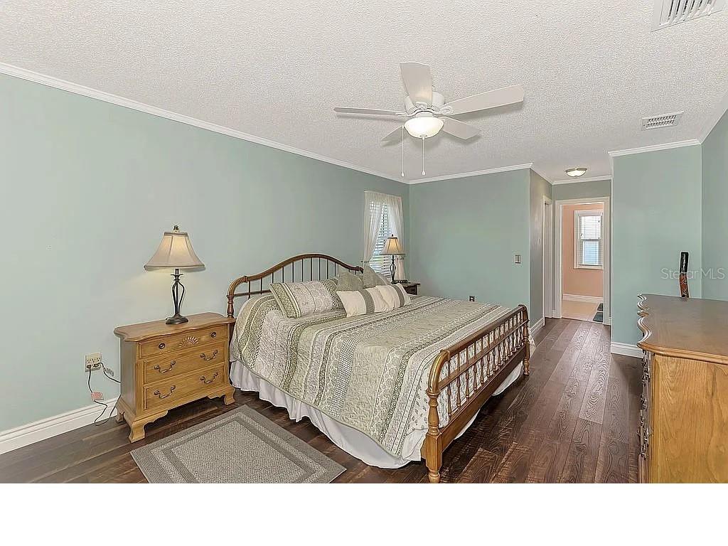 5231 Conner Terrace Port Charlotte, FL 33981 - Photo 28 of 66 a bedroom with a bed and a chandelier