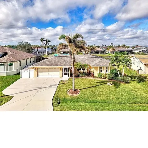a view of a house with a backyard porch and sitting area
