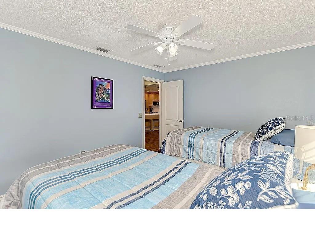 5231 Conner Terrace Port Charlotte, FL 33981 - Photo 37 of 66 a bedroom with bed and a chandelier