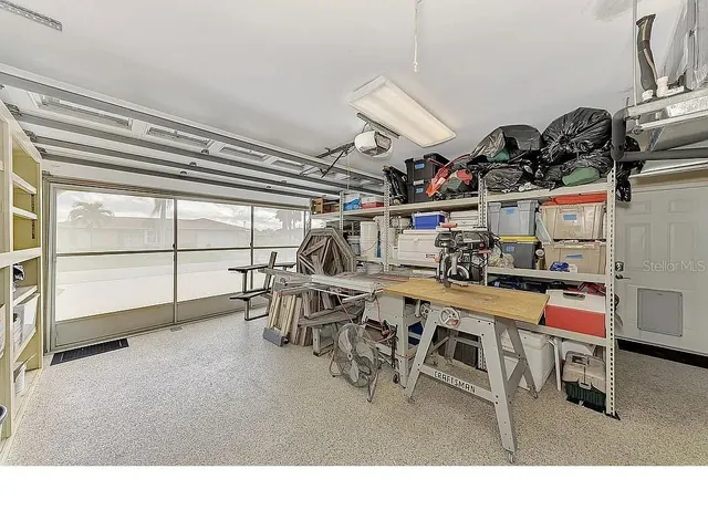 a view of a chairs and table in the patio