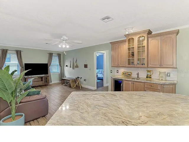 a kitchen with a refrigerator stove and microwave
