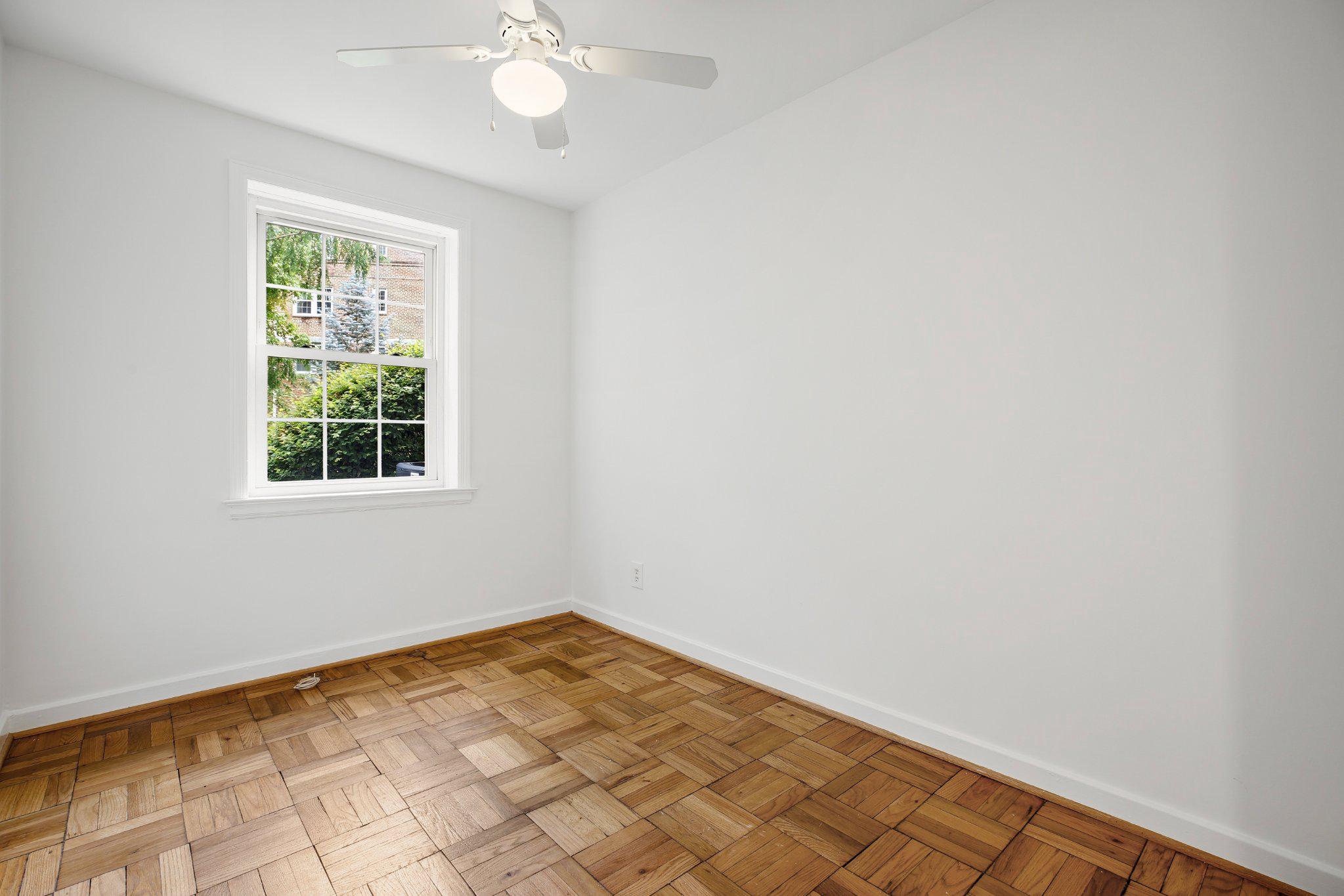 2202 Colston Drive, Unit 102 Silver Spring, MD 20910 - Photo 13 of 38 an empty room with a window