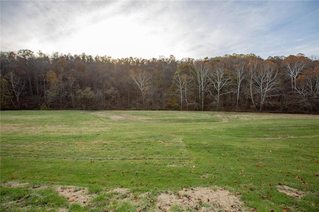 195 West W Railroad Road Sycamore, PA 15364 - Photo 13 of 50 a view of a field with mountains in the background