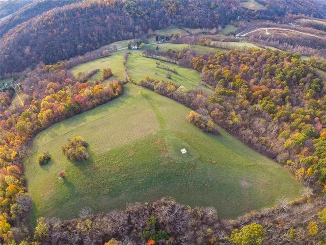 a living room with furniture a chandelier and a flat screen tv