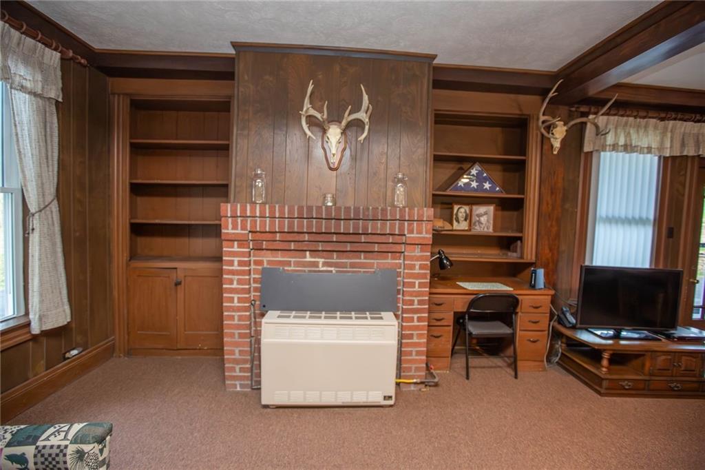 195 West W Railroad Road Sycamore, PA 15364 - Photo 26 of 50 a living room with furniture and a flat screen tv