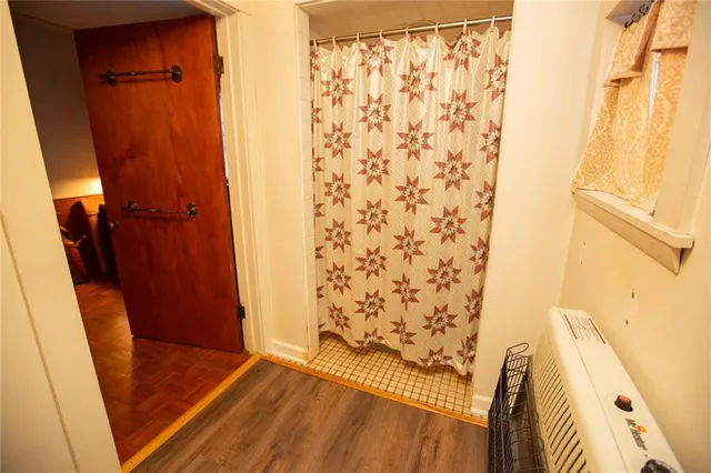 a bedroom with a bed and dresser